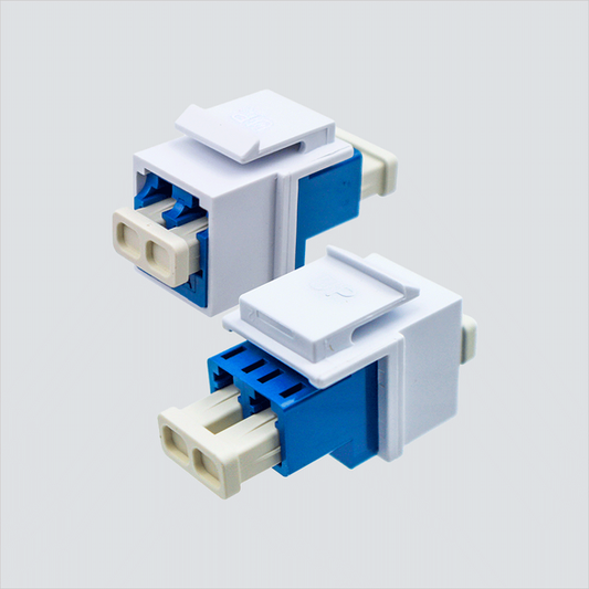 Two views of Wavenet FOKSBLCWH blue duplex LC adapter in a white keystone housing