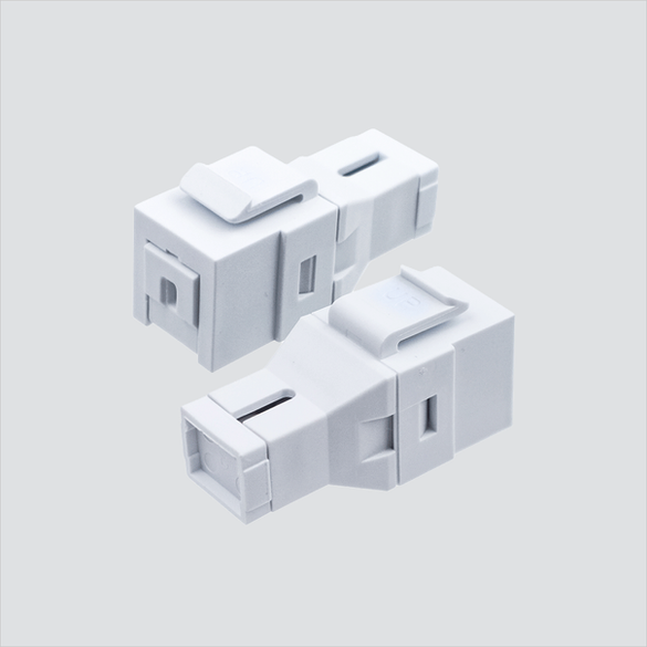Two views of Wavenet FOKSBSCWH white shuttered simplex SC keystone coupler